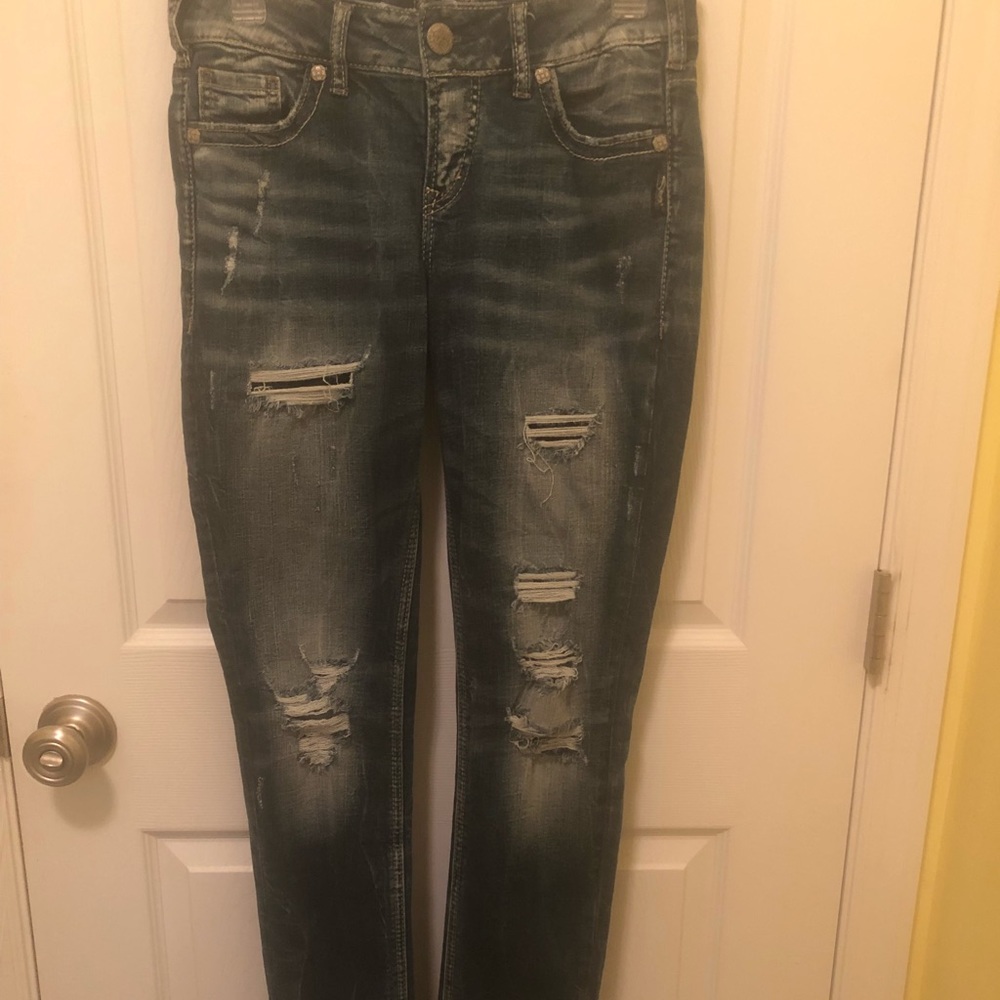 Distressed silver jeans